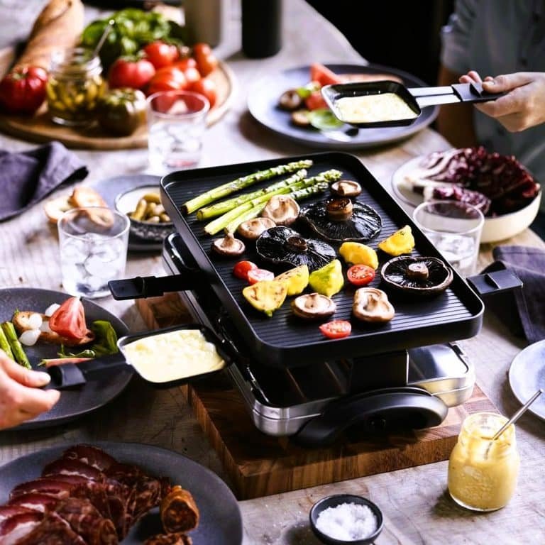 Raclette grill with veg cooking on top 65