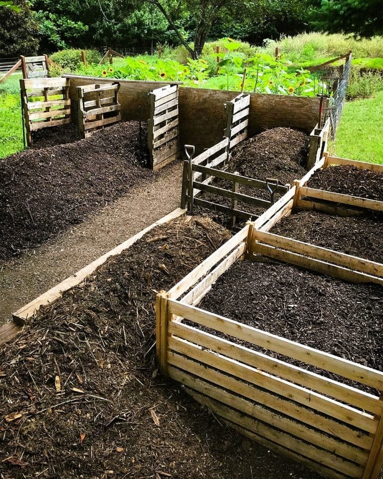 Compost piles in wooden enclosures 720