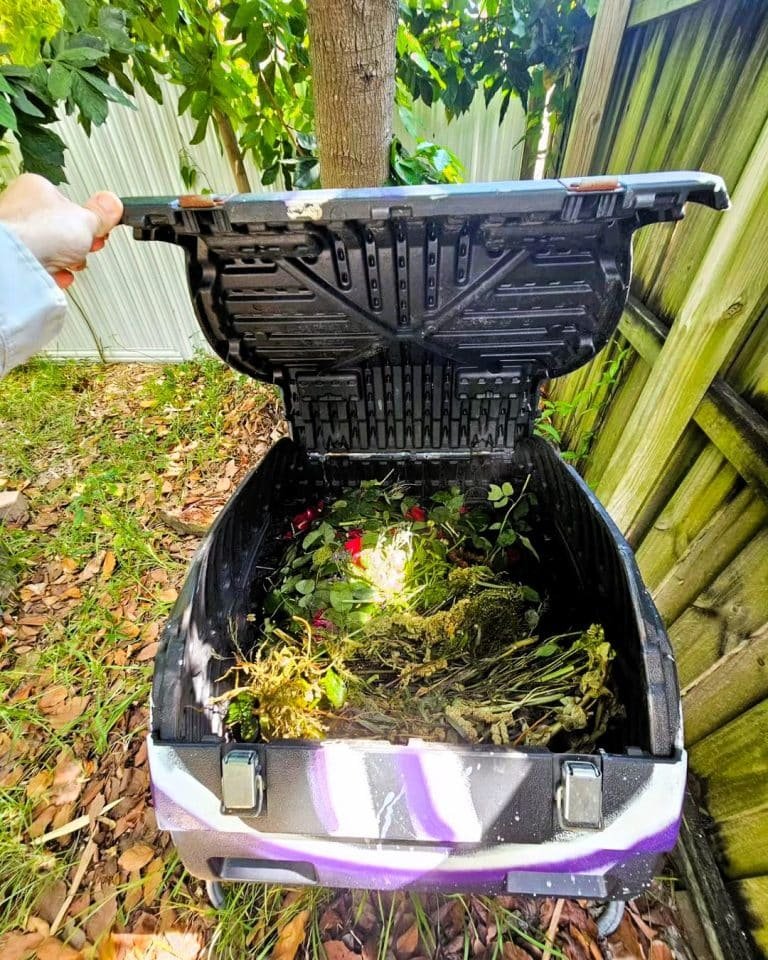 Compost tumbler with food scraps in it 750