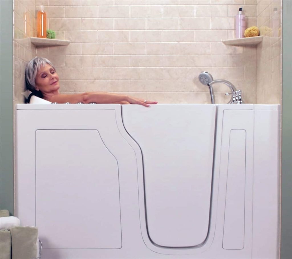 A woman enjoying a luxurious deep soak in a walk-in bath, experiencing comfort and relaxation
