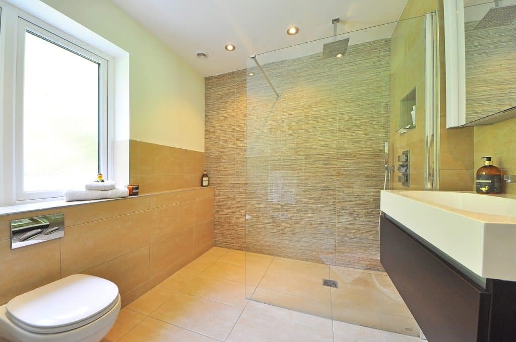An image capturing the spacious and open design of a modern wet room, highlighting its accessibility and versatility for bathing
